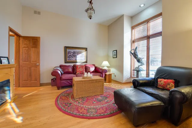 a spacious bedroom with a bed and a flat screen tv