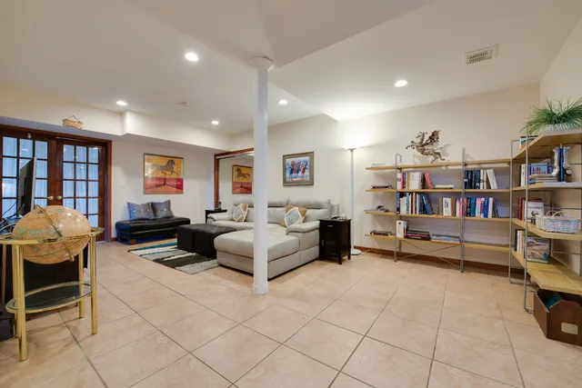 a bathroom with double sink and a mirror