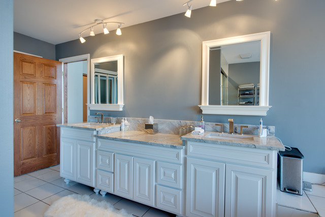 14080 West Old School Road Mettawa, IL 60048 - Photo 25 of 64 a bathroom with double sink and a mirror