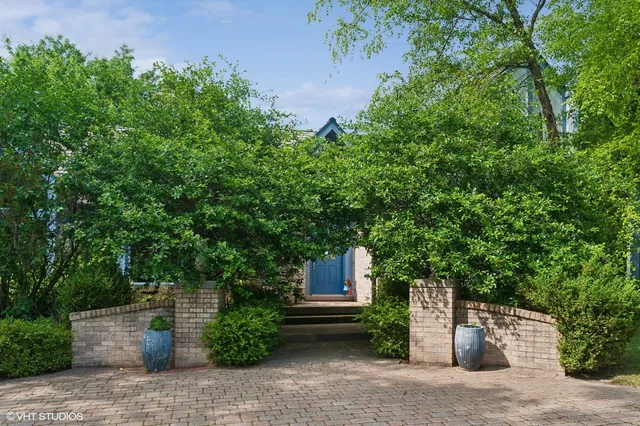 a front view of a house with garage