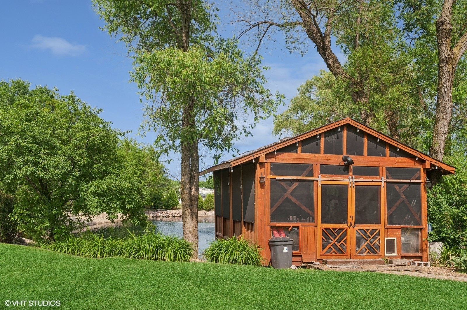 14080 West Old School Road Mettawa, IL 60048 - Photo 38 of 64 a view of a backyard with potted plants and large trees