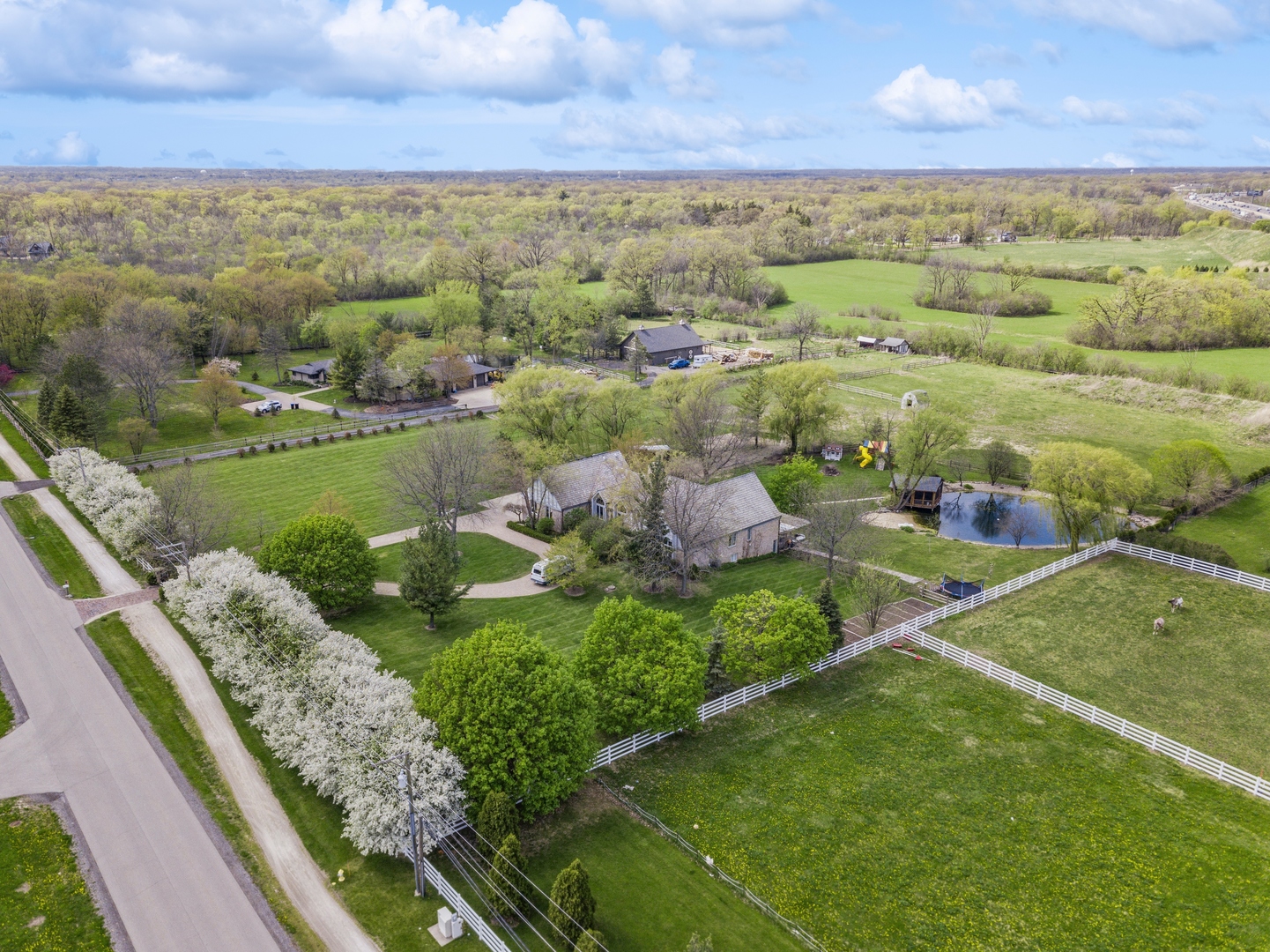 14080 West Old School Road Mettawa, IL 60048 - Photo 47 of 61 a view of a city with flower plants