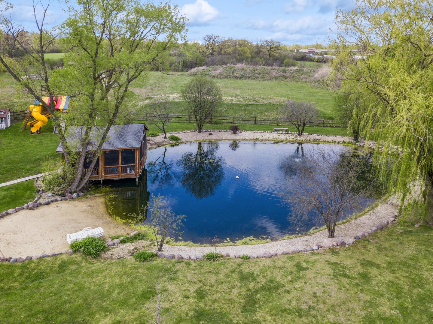 14080 West Old School Road Mettawa, IL 60048 - Photo 53 of 64 a view of a lake with a yard