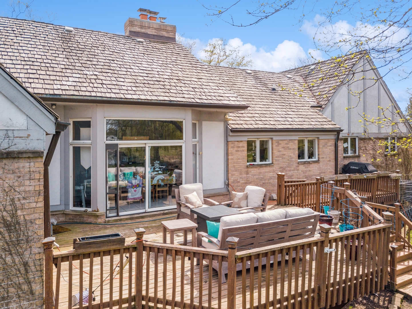 14080 West Old School Road Mettawa, IL 60048 - Photo 60 of 64 a view of a patio with couches chairs and a potted plant