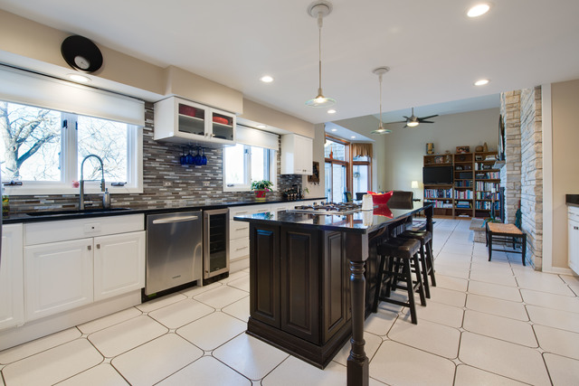 14080 West Old School Road Mettawa, IL 60048 - Photo 9 of 64 a kitchen with stainless steel appliances granite countertop a sink a stove a dining table and chairs