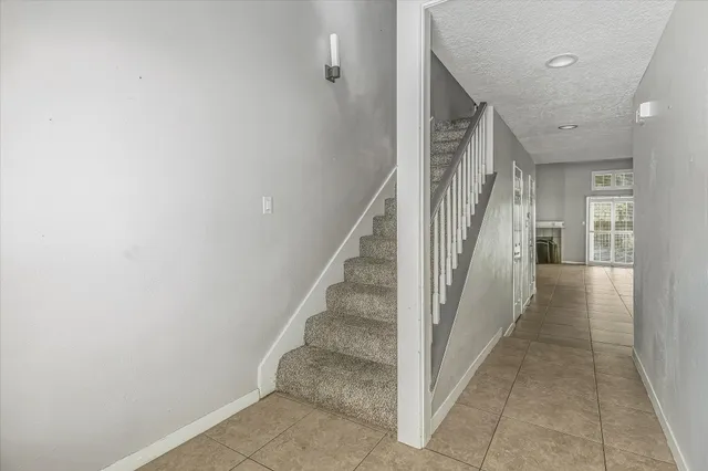 a view of a hallway with staircase