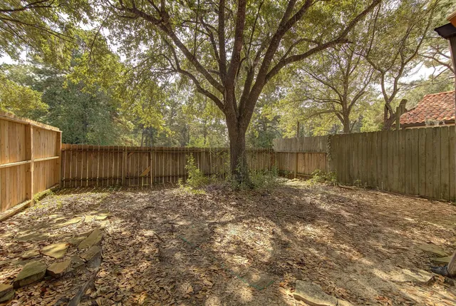 a backyard of a house with lots of green space