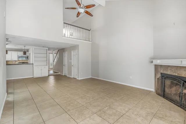 a view of an empty room with a fireplace