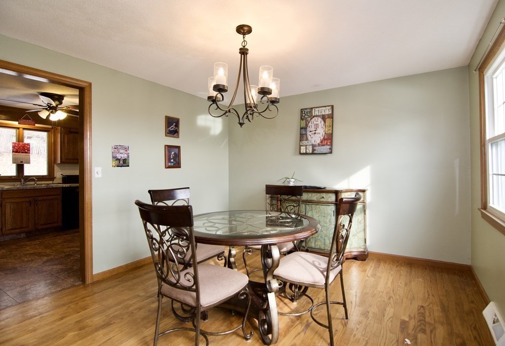102 Stebbins Road Monson, MA 01057 - Photo 18 of 35 a view of a dining room with furniture and wooden floor