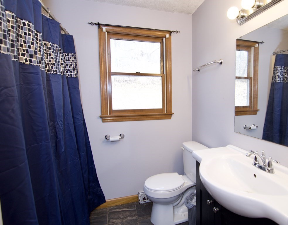 102 Stebbins Road Monson, MA 01057 - Photo 26 of 35 a bathroom with a sink a toilet and a mirror