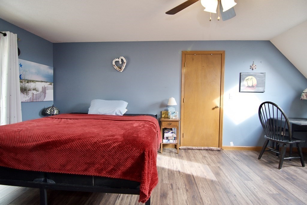 102 Stebbins Road Monson, MA 01057 - Photo 27 of 35 a bedroom with a bed and a chair