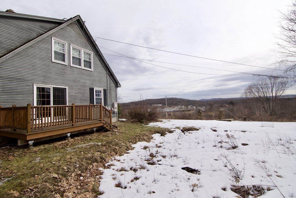 102 Stebbins Road Monson, MA 01057 - Photo 4 of 35 a view of a house with a yard covered with snow in the background