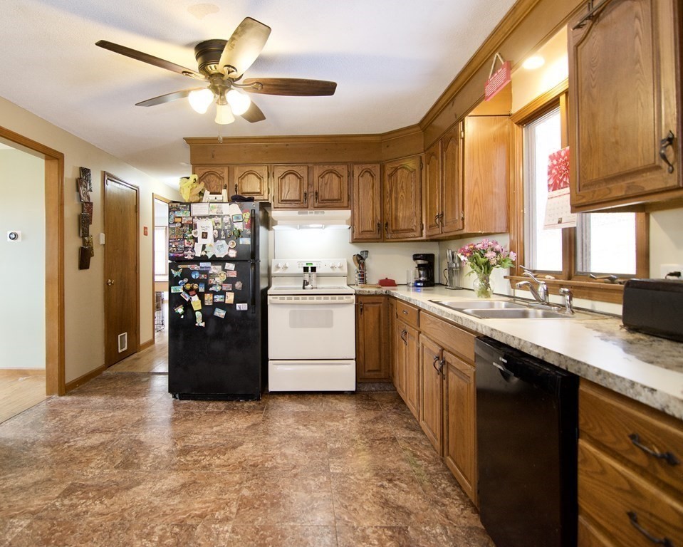 102 Stebbins Road Monson, MA 01057 - Photo 8 of 35 a kitchen with stainless steel appliances granite countertop a refrigerator and a sink