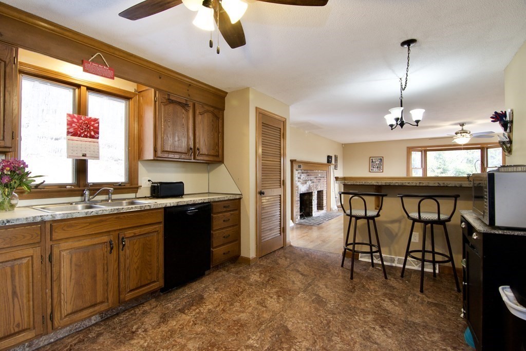 102 Stebbins Road Monson, MA 01057 - Photo 10 of 35 a large kitchen with a table and chairs