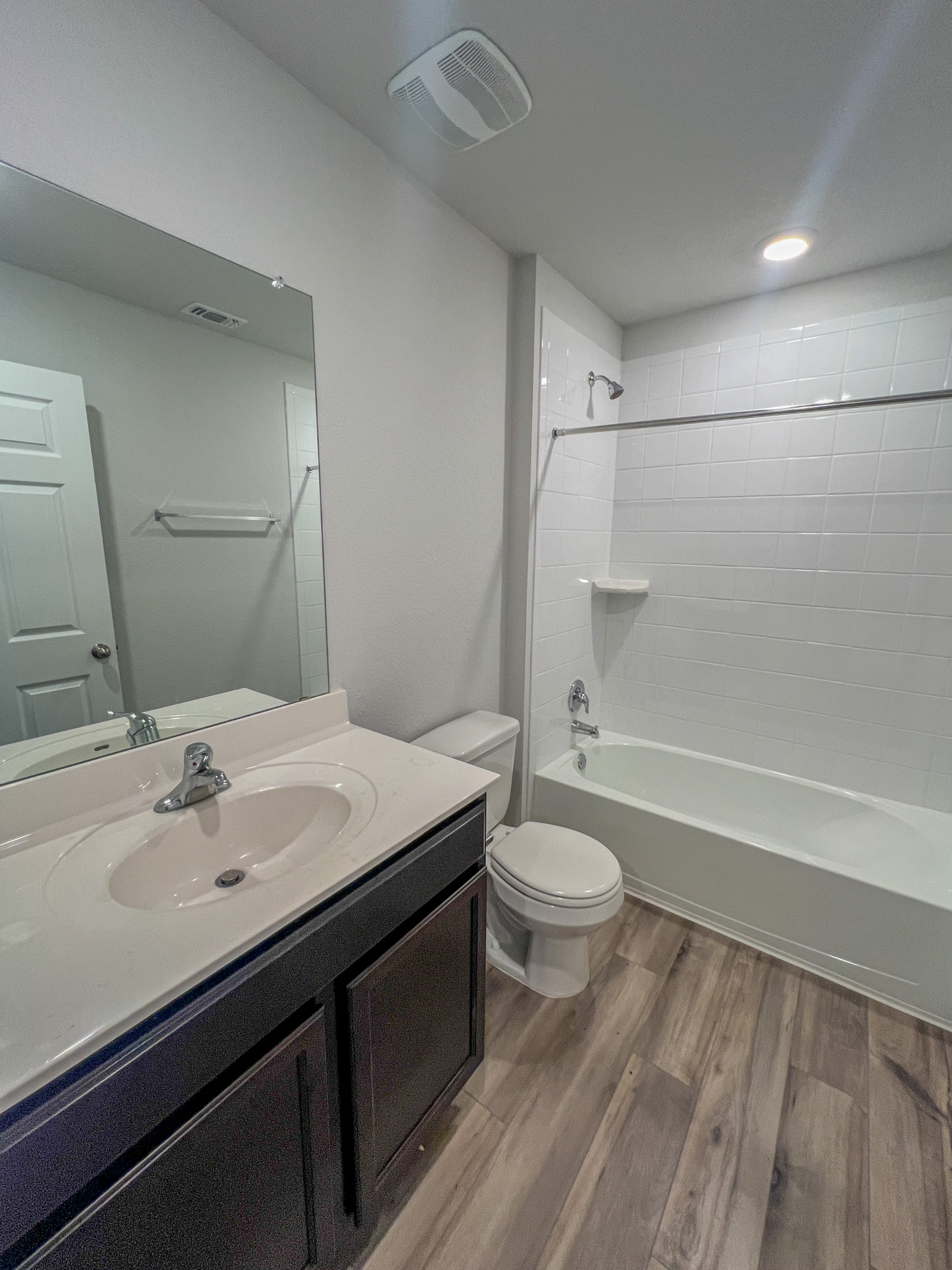 100 Taggart Trail Jarrell, TX 76537 - Photo 8 of 18 a bathroom with a sink a toilet a mirror and shower