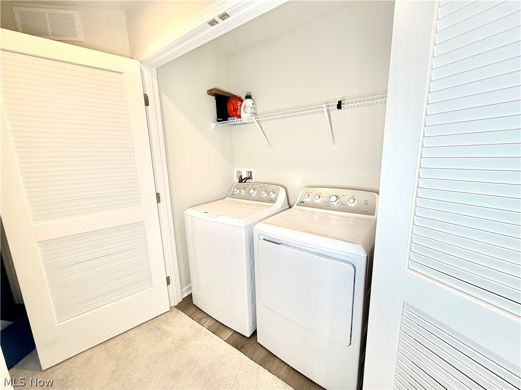 153 Raintree Lane Painesville, OH 44077 - Photo 12 of 13 Laundry area with washing machine and dryer