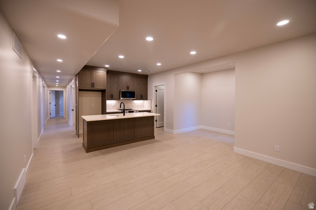 904 South 1900 West Layton, UT 84041 - Photo 16 of 19 Kitchen with recessed lighting, a kitchen island with sink, light wood-type tile flooring, and stainless steel appliances