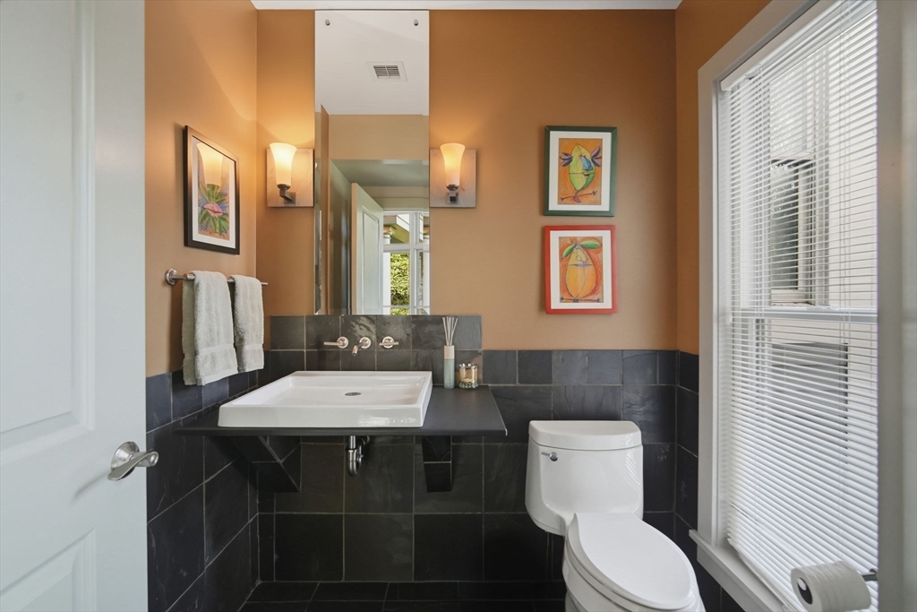 24 Prynne Ridge Road Longmeadow, MA 01106 - Photo 21 of 42 a bathroom with a toilet a sink and a mirror