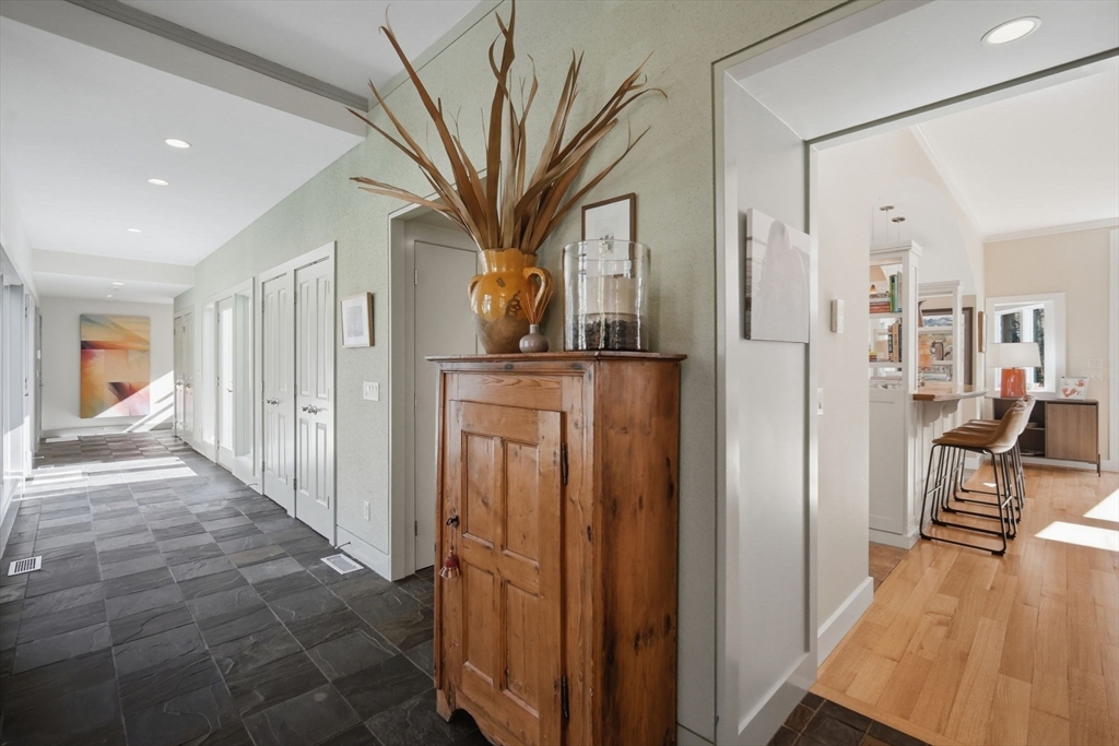 24 Prynne Ridge Road Longmeadow, MA 01106 - Photo 23 of 42 a view of a hallway with wooden floor and a living room