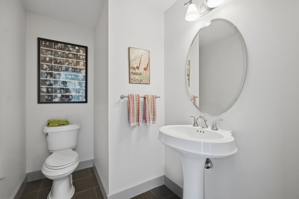24 Prynne Ridge Road Longmeadow, MA 01106 - Photo 26 of 42 a bathroom with a toilet sink and mirror