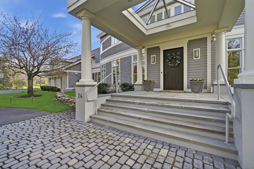 24 Prynne Ridge Road Longmeadow, MA 01106 - Photo 6 of 42 a front view of a house with a garden