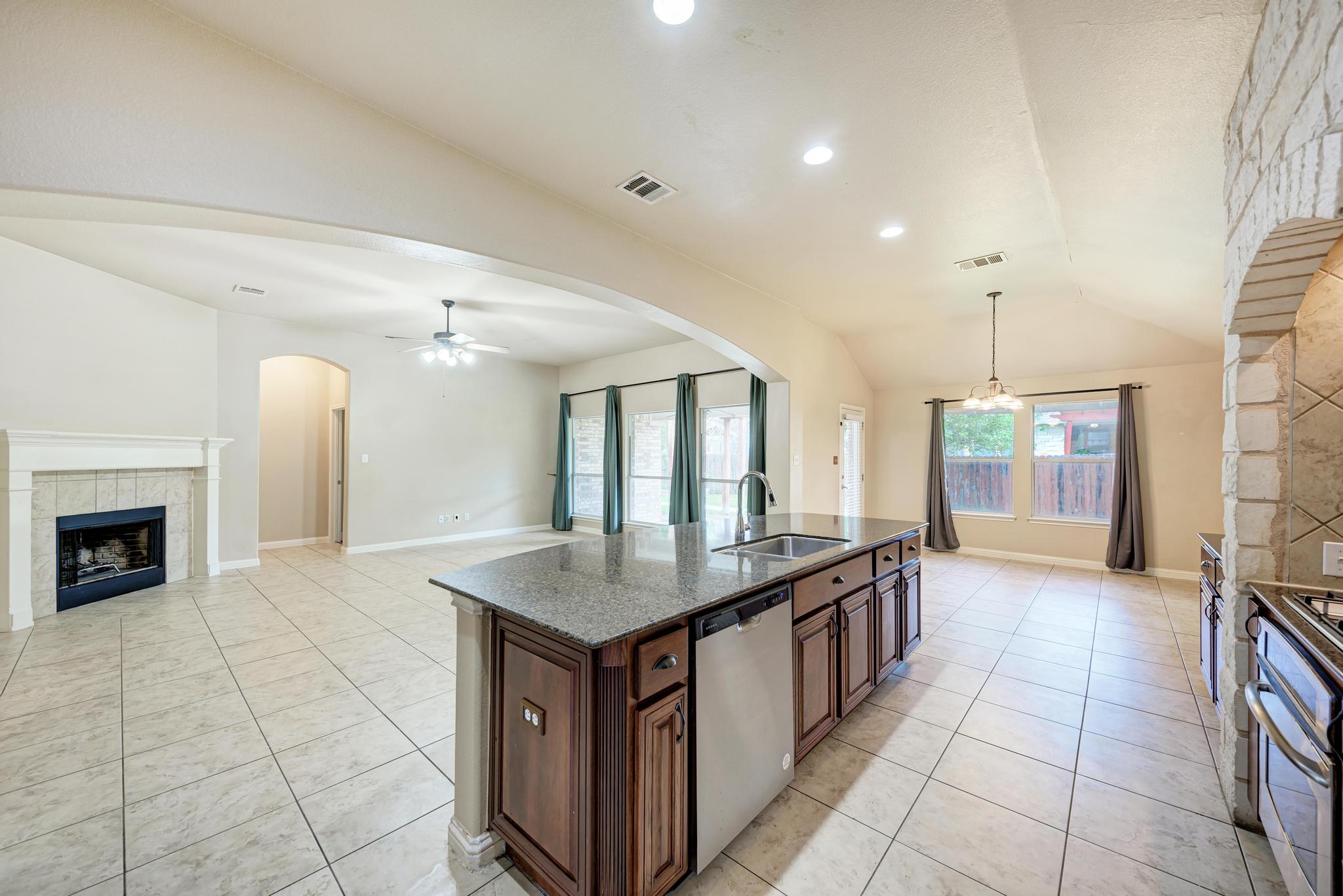 18308 Shallow Pool Drive Pflugerville, TX 78660 - Photo 13 of 40 Easy sight lines to the living room and breakfast nook.