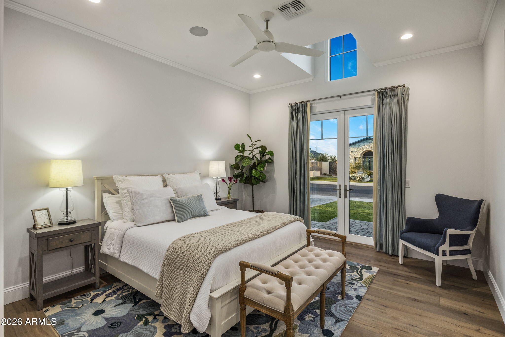 2677 East Maplewood Street Gilbert, AZ 85297 - Photo 11 of 20 a bedroom with a bed and a chair