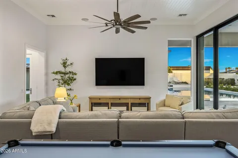 a bedroom with a bed and a chair