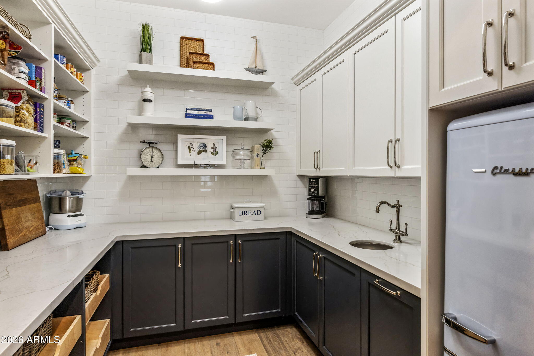 2677 East Maplewood Street Gilbert, AZ 85297 - Photo 13 of 20 a kitchen with stainless steel appliances granite countertop a sink and cabinets