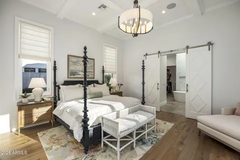 a living room with furniture a table and a potted plant