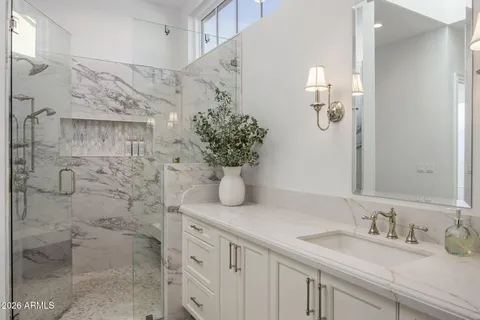 a white bath tub sitting in a en suite bathroom