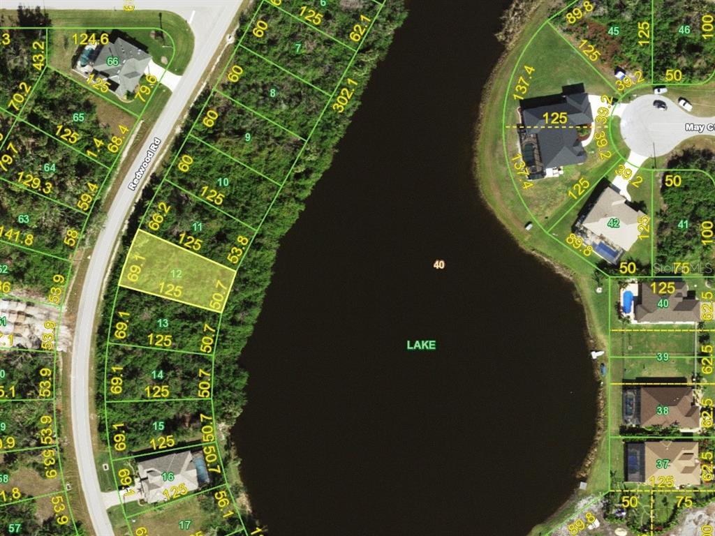 an aerial view of a residential houses with outdoor space