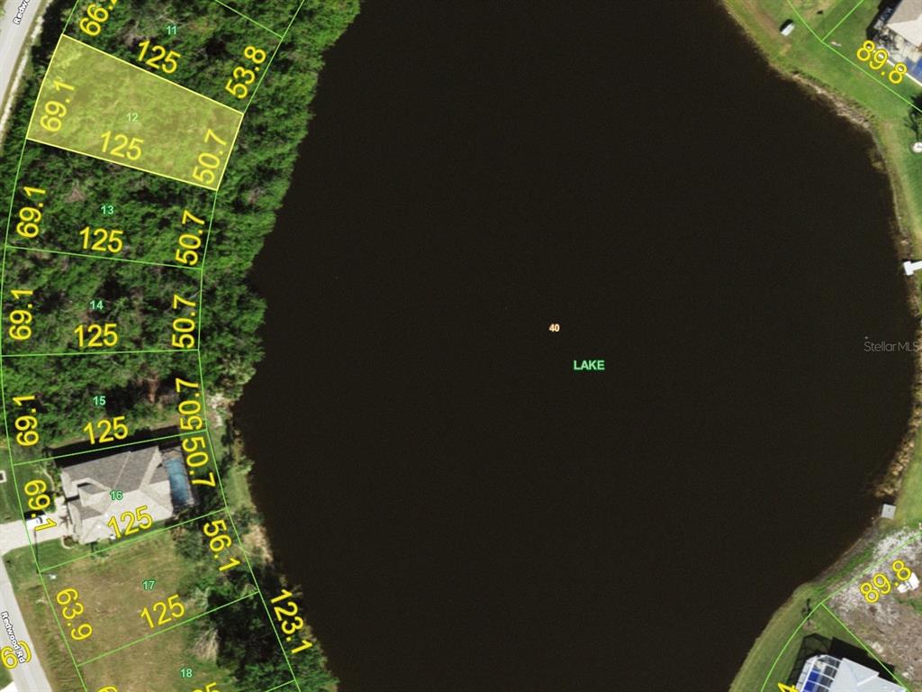 155 Redwood Road Rotonda West, FL 33947 - Photo 4 of 4 a view of a yard