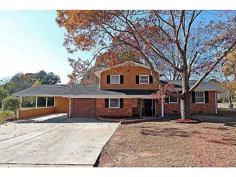3171 Wesley Chapel Road Decatur, GA 30034 - Photo 1 of 1 a front view of a house with a yard