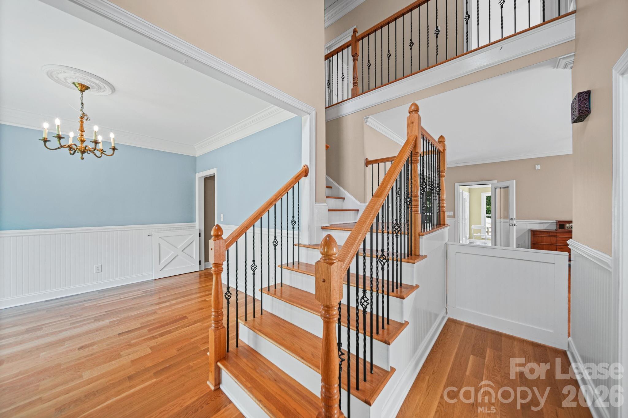 7107 Nesbit Road Waxhaw, NC 28173 - Photo 8 of 42 a view of entryway and hall with wooden floor