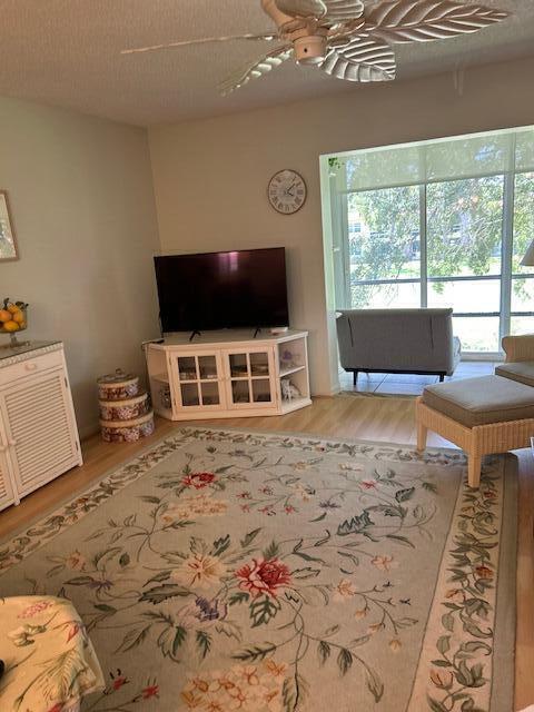 1955 Southwest Palm City Road, Unit H Stuart, FL 34994 - Photo 8 of 22 a room with furniture and a flat screen tv