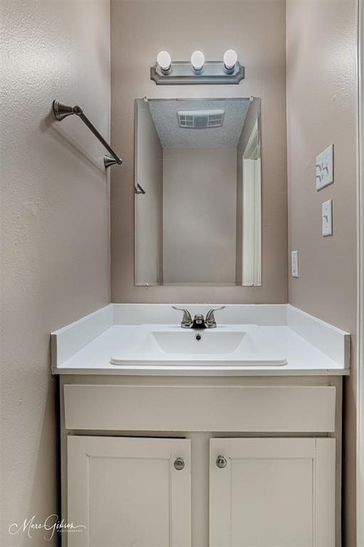 5705 East Texas Street, Unit 80 Bossier City, LA 71111 - Photo 9 of 15 a bathroom with a sink a vanity and a mirror