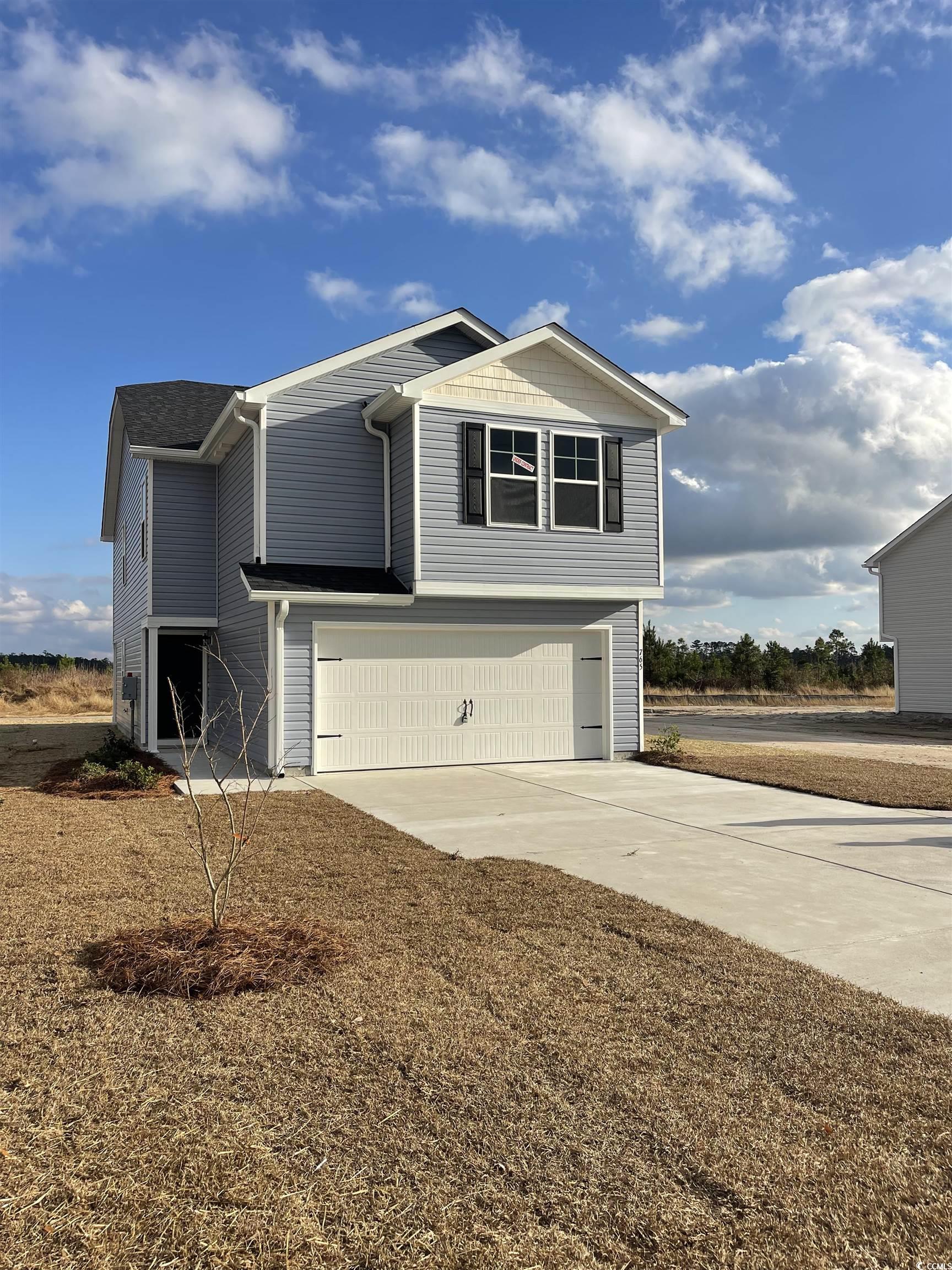 765 Busy Corner Road Conway, SC 29527 - Photo 3 of 4 View of property exterior featuring a garage