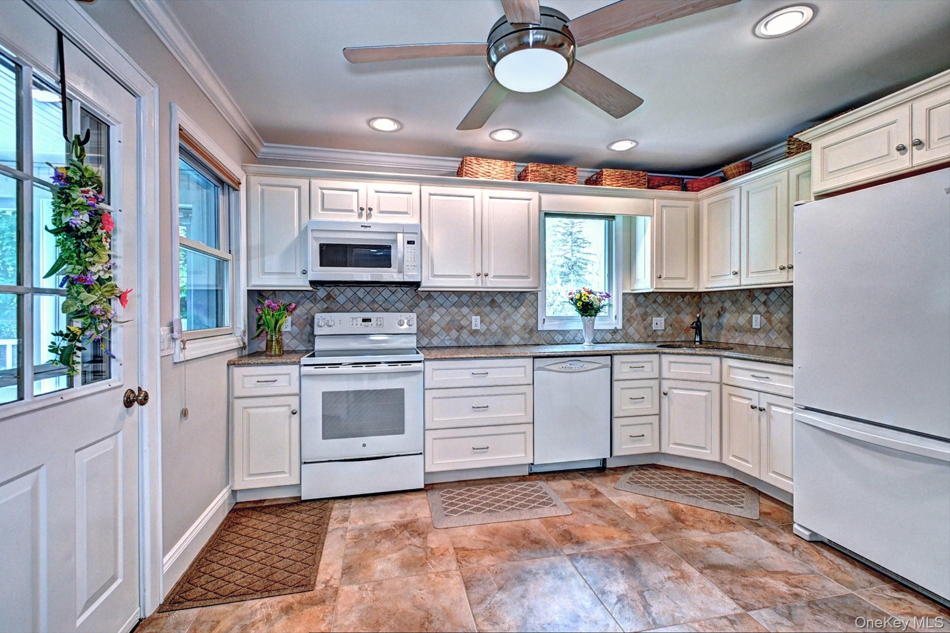 20 Valentine Road Shoreham, NY 11786 - Photo 9 of 39 Updated Antique White Cabinetry and Decorative Backsplash