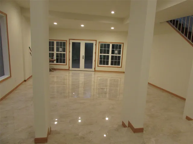 a view of an empty room with windows