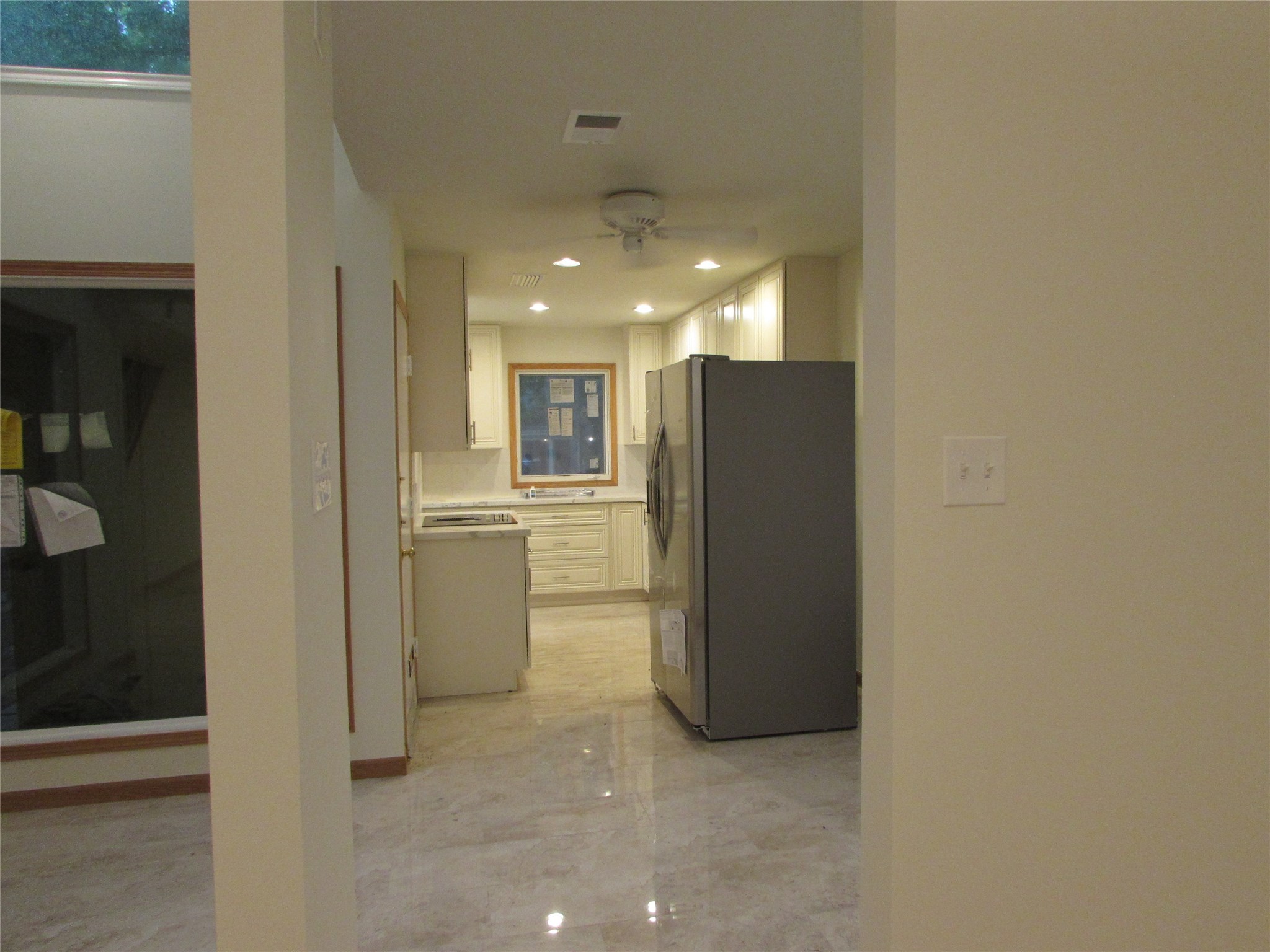 201 Vanderpool Lane, Unit 19 Houston, TX 77024 - Photo 5 of 23 a view of kitchen with a refrigerator and a sink