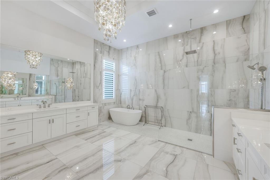 18250 Blue Eye Loop Fort Myers, FL 33913 - Photo 19 of 48 a spacious bathroom with double sink and shower