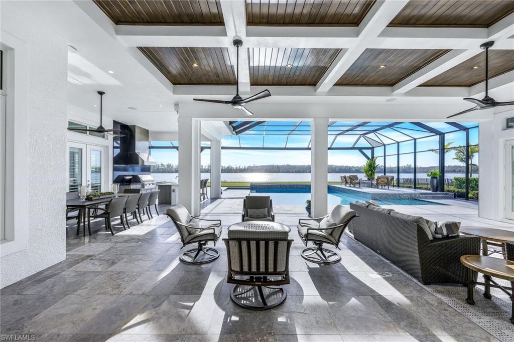 18250 Blue Eye Loop Fort Myers, FL 33913 - Photo 32 of 48 a living room with furniture and a floor to ceiling window