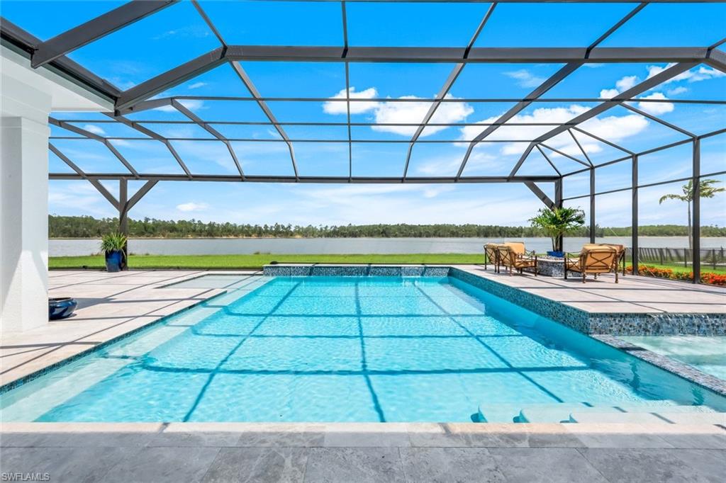 18250 Blue Eye Loop Fort Myers, FL 33913 - Photo 34 of 48 a view of a swimming pool with a patio