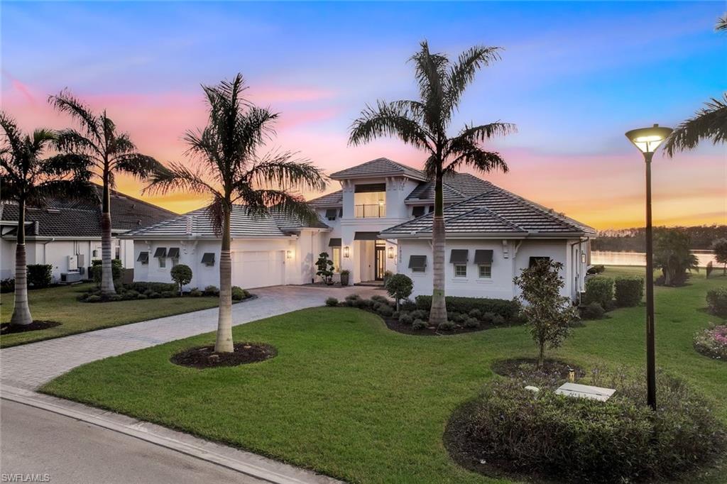 18250 Blue Eye Loop Fort Myers, FL 33913 - Photo 40 of 48 a front view of a house with garden