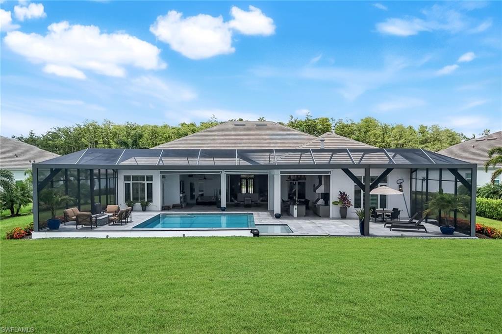 18250 Blue Eye Loop Fort Myers, FL 33913 - Photo 46 of 48 a front view of a building with garden