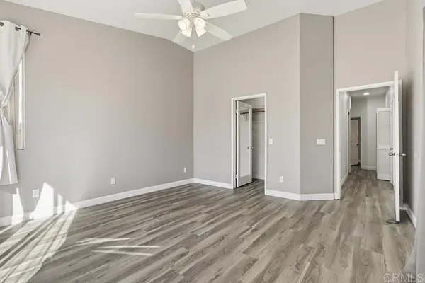 a view of livingroom with hardwood floor and ceiling fan