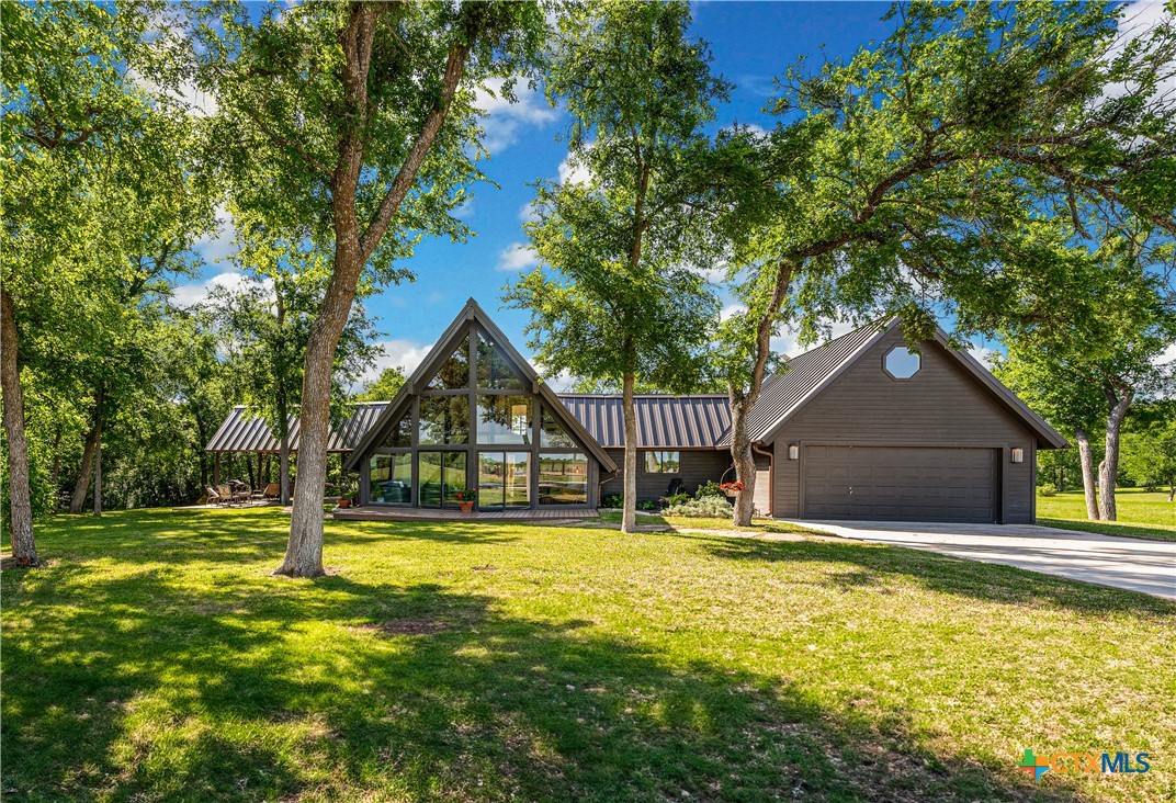 4158 Creek Road Temple, TX 76501 - Photo 1 of 47 a house with swimming pool in front of it