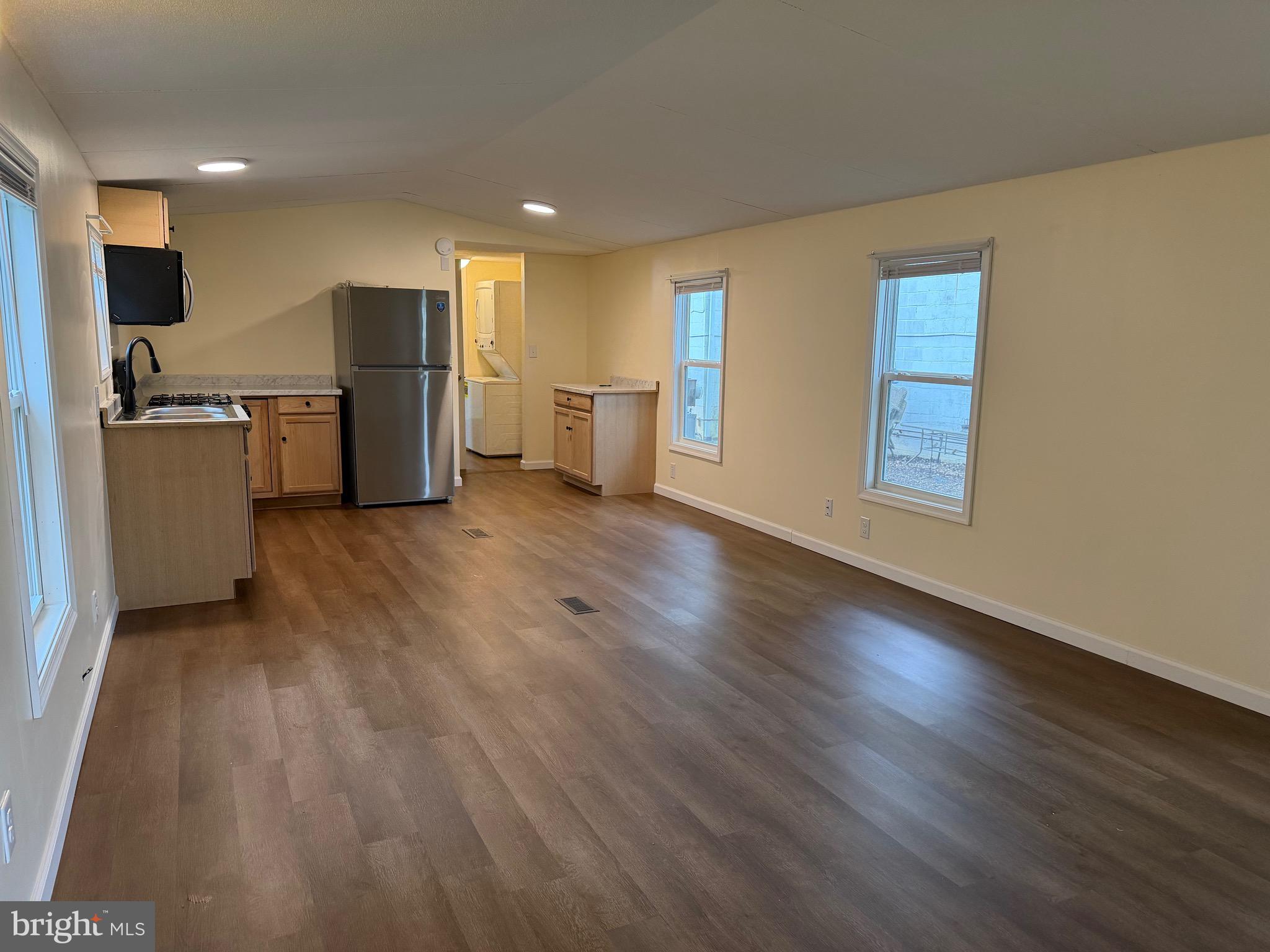 1104 West Elm Avenue Hanover, PA 17331 - Photo 4 of 13 a view of kitchen with stainless steel appliances wooden floor and a window