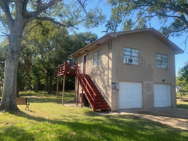 4859 Harrison Avenue Groves, TX 77619 - Photo 11 of 14 a view of a house with a yard